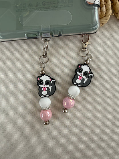 Cutie Skunk Tethered Charm