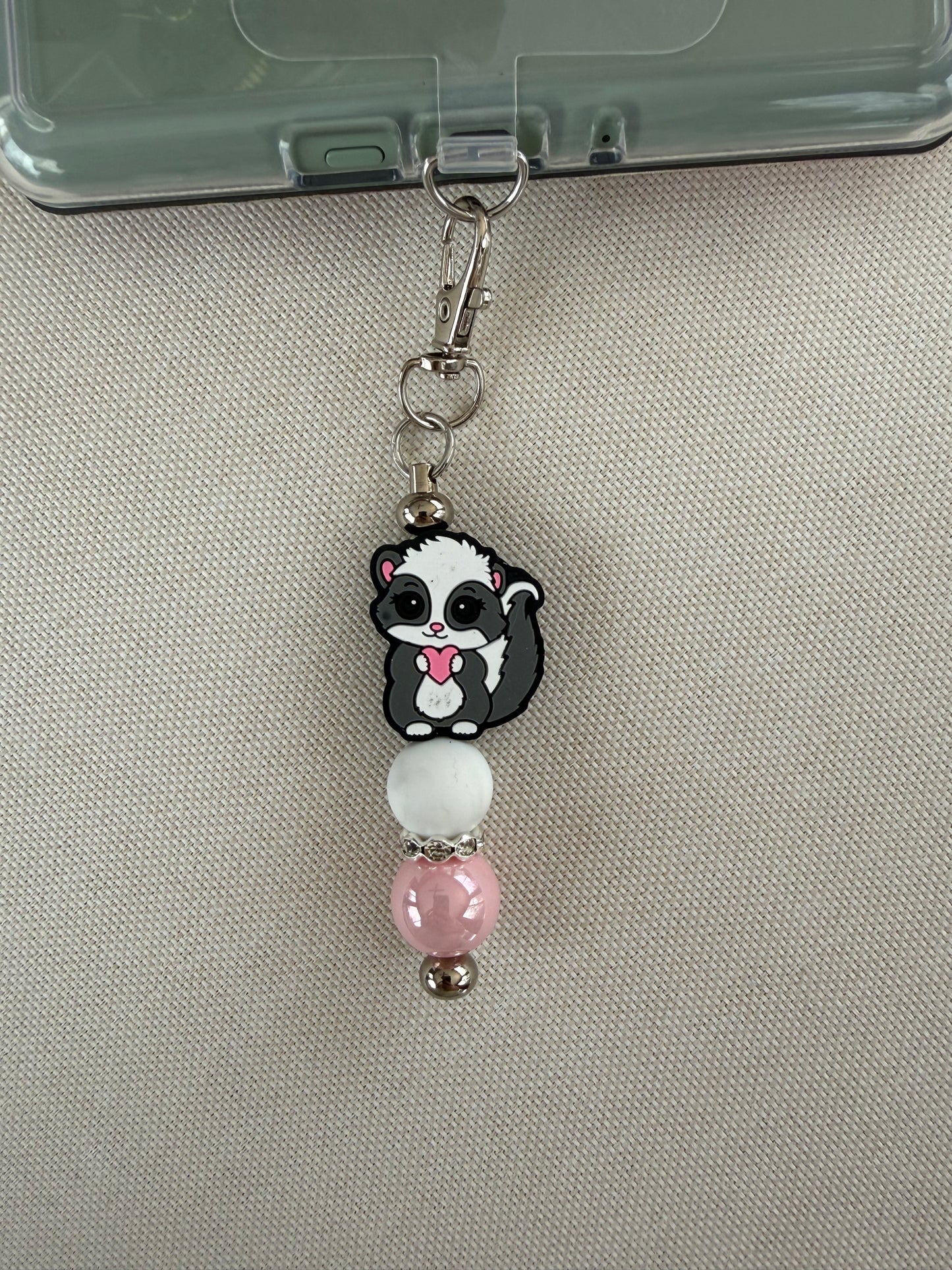 Cutie Skunk Tethered Charm