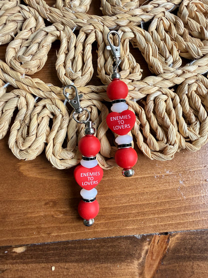 Enemies to lovers tethered charm